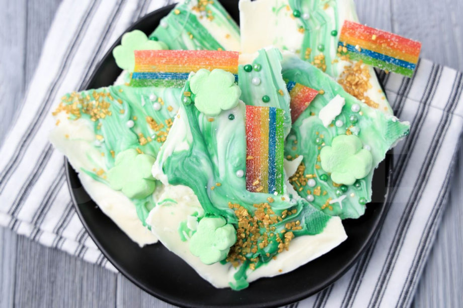 The Leprechaun Bark comes on a black plate with a white striped napkin on a gray wood backdrop.