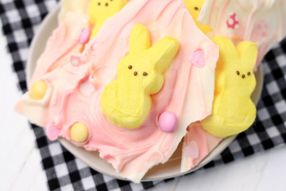 The Peeps Bunny Bark comes on a white plate with a plaid napkin on a white wood backdrop.
