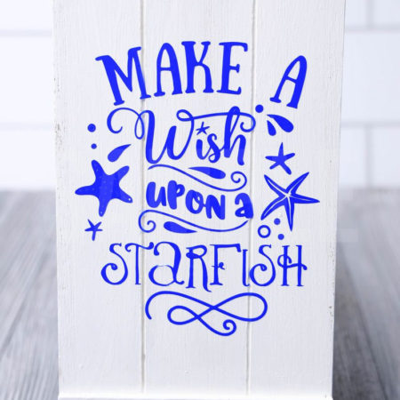 The Make A Wish Starfish Cricut Dollar Tree DIY comes pictured on a gray wood backdrop.