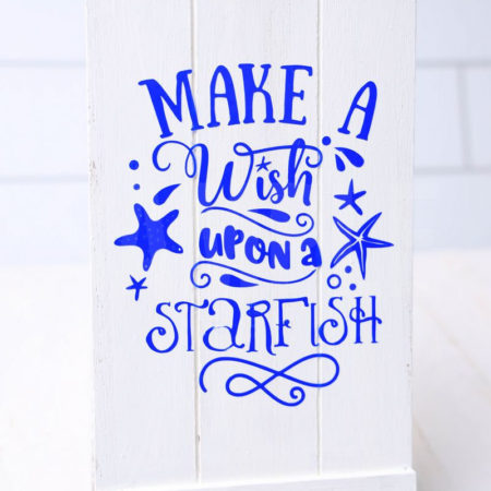 The Make A Wish Starfish Cricut Dollar Tree DIY comes pictured on a white wood backdrop.