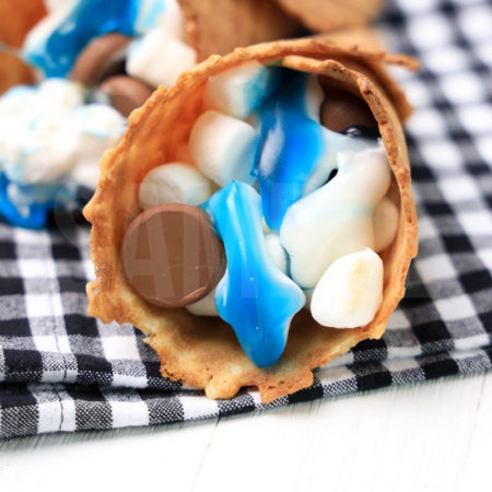 The Shark Campfire Cones comes on a plaid napkin on a white wood backdrop.