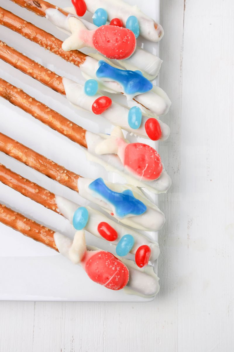 The Sealife Pretzel Rods comes on a white plate with a white wood backdrop.