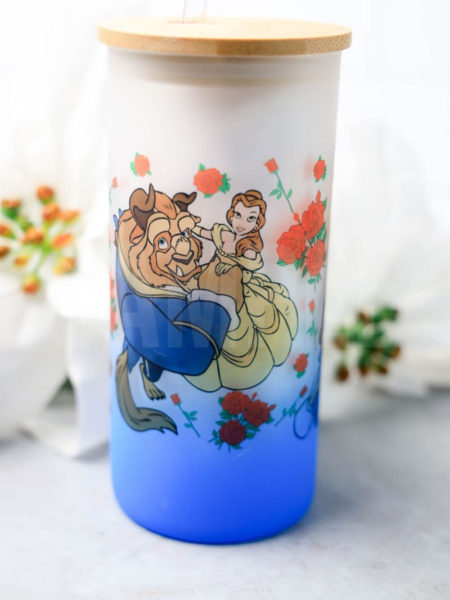 The Beauty and The Beast Glass Can Tumbler Exclusive comes on a gray backdrop.