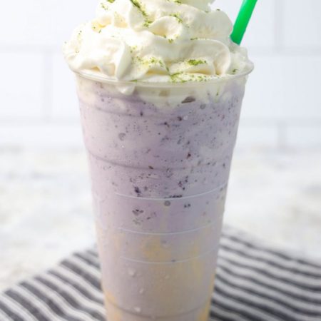 The Halloween Frappuccino Starbucks Copycat comes in a venti cup with a gray striped napkin on a marble backdrop.