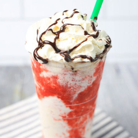 The IT Frappuccino Starbucks Copycat comes in a venti cup with a white striped napkin on a gray wood backdrop.