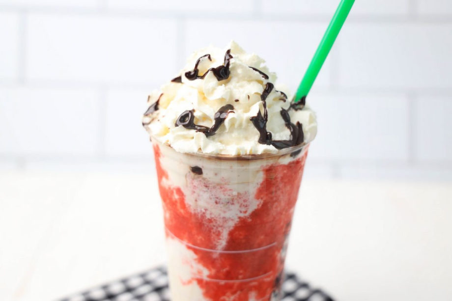 The IT Frappuccino Starbucks Copycat comes in a venti cup with a plaid napkin on a white wood backdrop.