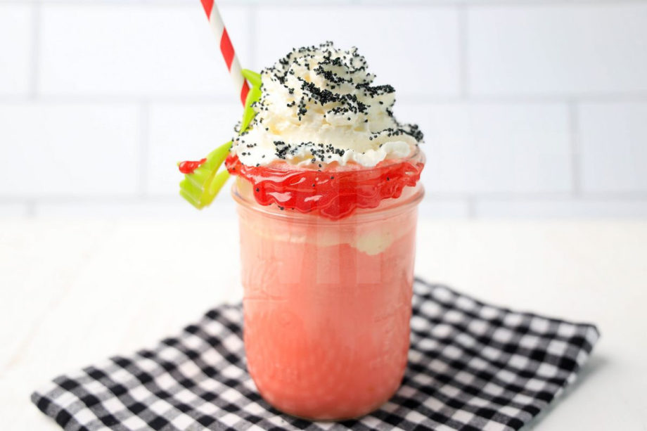 The Vampire Float comes in a mason jar with a plaid napkin on a white wood backdrop.