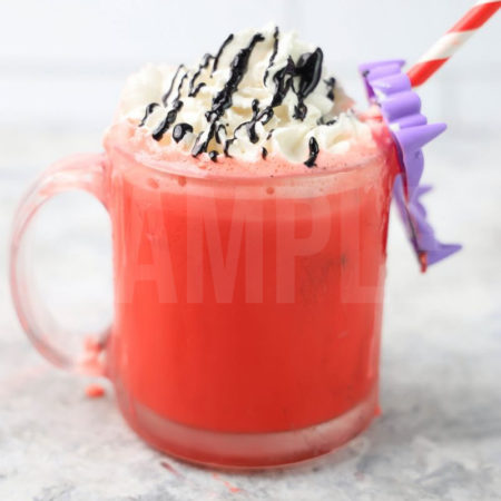 The Vampire Hot Chocolate comes in a glass coffee mug on a marble backdrop.