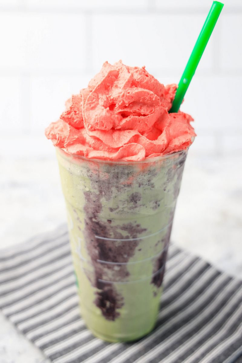 The Zombie Frappuccino Starbucks Copycat comes in a venti cup with a gray striped napkin on a marble backdrop.