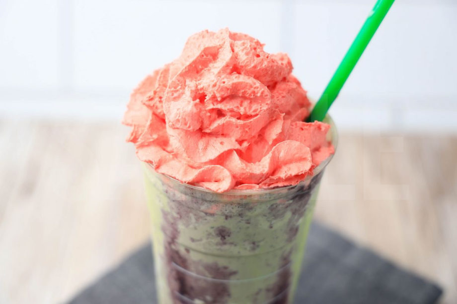 The Zombie Frappuccino Starbucks Copycat comes in a venti cup with a gray striped napkin on a rustic wood backdrop.