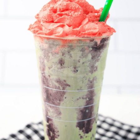 The Zombie Frappuccino Starbucks Copycat comes in a venti cup with a plaid napkin on a white wood backdrop.