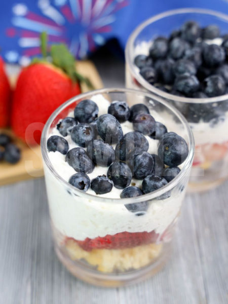 The Patriotic Trifle comes in a clear glass with gray wood backdrop.
